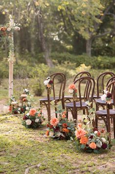 an outdoor ceremony set up with chairs and flowers