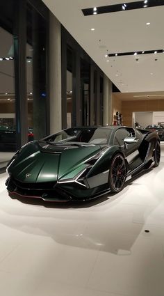 a very nice looking car in a big room