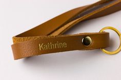 The perfect blend of style and functionality with our customizable leather lanyard. Designed to effortlessly hold keys and ID badges, wear it comfortably around your neck for hands-free convenience. Its double loop design over a golden split ring guarantees durability, while the matching rivet enhances stability. Ideal for nurses, teachers, coworkers, and bridal parties, this leather necklace lanyard can be personalized, making it a modern and thoughtful gift. Leather Lanyard, Gold Fronts, Leather Scraps, Bridal Parties, Gold Monogram, Modern Gift, Split Ring, Id Badge, Custom Leather