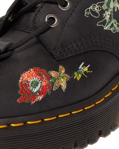 Our Gomez Wild Botanics boot is a classic Docs silhouette with a floral twist. The botanical embroidery has been designed in-house and the lace has been woven through eyelets, secured at the toe with a buckle. Built with durable Moldova leather. Moldova WP is a super-soft, textured leather with a light but oily feel and water resistant finish. Clean with a damp cloth and care with Dr. Martens Wonder Balsam Silver eyelets Built with core Dr. Martens DNA: grooved edges, an AirWair heel loop and vi Black Floral Print Boots With Round Toe, Black Leather Boots With Floral Print, Botanical Embroidery, Boots Uk, Thick Socks, Goodyear Welt, On Shoes, Fashion Backpack, Water Resistant