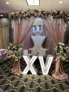 an elegant wedding setup with chairs and flowers