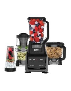 the ninja blender is full of fruit and veggies, ready to be blended