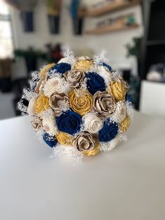 the bridal bouquet is made up of paper flowers and snow flakes on top