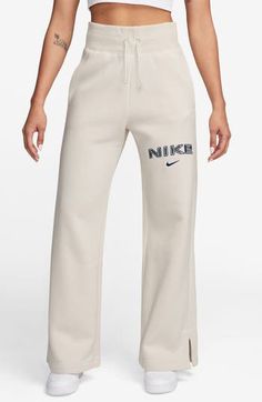 Add some sporty yet cozy vibes to your loungwear wardrobe with these wide-leg sweatpants made from midweight fleece. Elastic/drawstring waist Front slant pockets 80% cotton, 20% polyester Machine wash, line dry Imported Cozy Leisure Sweats, Cozy Nike Sweats, Casual Sports Sweatpants With Drawstring, Sporty Cotton Sweatpants For Spring, Athleisure Wide Leg Joggers With Drawstring, Wide Leg Sportswear Joggers For Leisure, Athleisure Wide-leg Joggers With Drawstring, Wide Leg Cotton Sweats Athleisure Style, Cozy Sweatpants With Ribbed Waistband