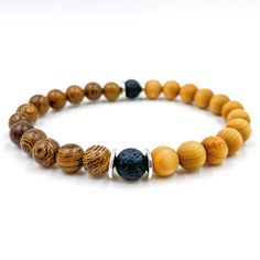 Handmade | Natural | Lifetime Warranty The Westland Collection brings a stylish beaded bracelet to your wrist featuring 8mm beads. Designed with black volcanic lava rock, brown zebrawood, and light cedar beads accented by silver spacers. Made from high quality materials with a fit that you will love. No other bracelet feels or looks this great on your wrist. Materials | Lava Rock, Zebrawood, Cedar, & Silver SpacersWidth | 8mm BeadsSize | Multiple Sizes Available Cord | Black Elastic Stretch Cord Casual Lava Stone Beaded Bracelets For Everyday, Casual Everyday Lava Stone Beaded Bracelets, Everyday Beaded Bracelets With 8mm Lava Stone Beads, Everyday Lava Stone Beaded Bracelets With 8mm Beads, Mala Beads Bracelet, Wood Bead Bracelet, 8mm Beads, Zebra Wood, Mala Bracelet