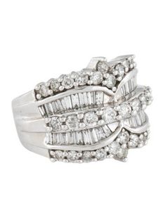 a white gold ring set with baguettes and round diamonds on the sides,