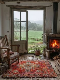 a living room filled with furniture and a fire place in front of a large window