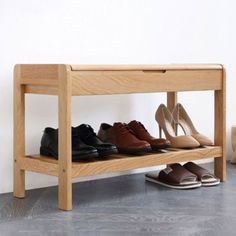 several pairs of shoes are lined up on a shelf