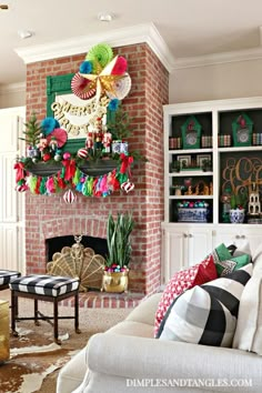 a living room filled with furniture and a fire place covered in christmas decorations next to a brick fireplace