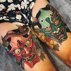 a woman's legs with tattoos on them, both covered in flowers and skulls