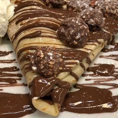 chocolate covered crepes and ice cream on a plate