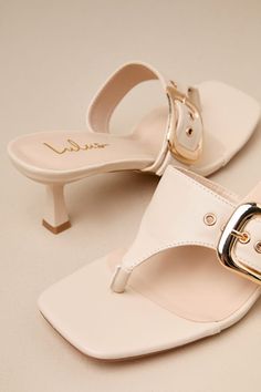 The Lulus Meline Bone Buckle Thong Slide Sandals are the fastest way to make any 'fit even more chic! Smooth faux leather shapes these must-have sandals that feature a trendy square footbed, a classic thong upper, and a wide vamp strap with an adjustable gold buckle detail at the side. An eye-catching sculpted heel completes the sleek slide-on design! 2. 5" sculpted heel. Lightly cushioned insole. Rubber sole has nonskid markings. Man made materials. Imported. Lulus | Meline Bone Buckle Thong Sl Chic T-strap Sandals With Toe Post And Buckle Closure, Chic Sandals With Buckle Closure And Toe Post, Chic Adjustable T-strap Sandals With Buckle Closure, Chic Adjustable T-strap Sandals With Buckle, Chic Toe Post Sandals With Buckle Closure, Chic T-strap Sandals With Buckle And Single Toe Strap, Chic T-strap Sandals With Heel And Toe Post, Chic T-strap Sandals With Heel Strap, Summer T-strap Sandals With Padded Heel