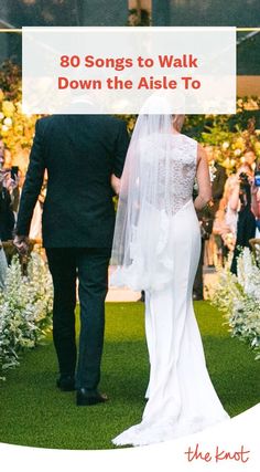 a bride and groom walking down the aisle