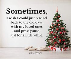 a christmas tree sitting in front of a wall that says, sometimes i wish i could just