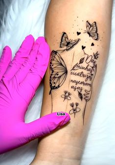 a woman's arm with butterflies on it and the words, i love you