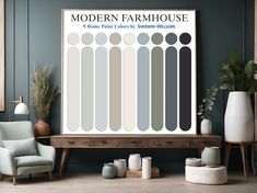 the modern farmhouse house poster is displayed in front of a chair and table with vases