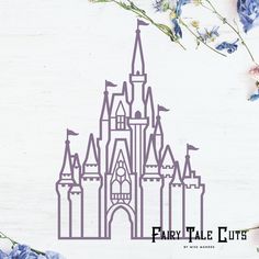 a paper cut out of a castle with blue flowers in front of it and the words fairy tale suites written below