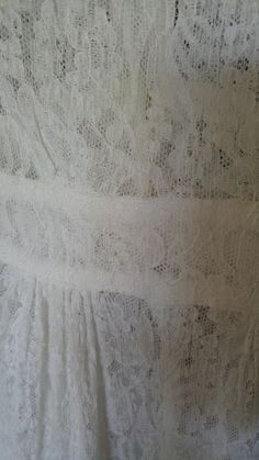 "20's Absolutely stunning lace maxi 'duster' style dress / night gown. Super pretty frilled collar with white ribbon tie at the front. The dress is open to the waist which has tiny fabric covered buttons and loops (one button covering missing) The dress is open down the middle of the skirt from waist to hem. Romantic sleeves 3/4 style with large frilly cuffs at elbows. Dress / night gown in such beautiful condition! Bust across 27\", waist when buttoned up 22\", sleeves 18 1/2\", dress length 53 Spring Daywear Lace Dress With Delicate Lace, Spring Day Lace Dress With Delicate Details, Spring Daywear Delicate Lace Dress, Delicate Lace Dress For Spring Daywear, Elegant Lace Dress With Lace Collar For Daywear, White Lace Maxi Dress For Daywear, Feminine Lace Dress With Lace Trim For Daywear, Feminine Lace Dress For Daywear, Lace Empire Waist Dress With Lace Trim