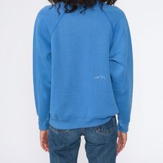 "Vintage 80s sweatshirt in blue with raglan sleeves. Distressed. Every garment we sell is authentic vintage and one-of-a-kind! You will receive the exact item photographed. Condition: Distressed. Has bleach spots and wear throughout Best fits women's: Medium Best fits men's: small Tag: sweats appeal by tultex Material: Cotton / polyester blend MEASUREMENTS Taken from seam to seam while the garment is lying flat. Double the armpit, waist, and hips For reference, model is 5'10\" and measures 32-23 Blue Raglan Sleeve Top For Streetwear, Blue Long Sleeve Sweatshirt For Everyday, Vintage Crew Neck Sweatshirt For Everyday, Vintage Crew Neck Everyday Sweatshirt, Retro Relaxed Fit Crew Neck Sweatshirt, Blue Crew Neck Tops For Everyday, Blue Cotton Sweatshirt For Everyday, Blue Cotton Everyday Sweatshirt, Retro Blue Fall Sweatshirt