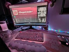 a desktop computer sitting on top of a desk next to a microphone and headphones