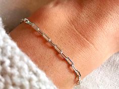 Dainty paperclip chain bracelet - perfect worn on its own, or layered with other bracelets.  Available in multiple sizes and finished with a solid sterling silver lobster clasp. Bracelet arrives packaged in a beautiful Stardust and Silver box, perfect for gifting or for storing your precious treasures.  Find our matching necklace here: https://www.etsy.com/uk/listing/855653307/sterling-silver-paperclip-necklace D E T A I L S  - Material: 925 Sterling Silver. Kind to skin, nickel free and hypoall Silver Paperclip Bracelet With Delicate Chain, Silver Delicate Chain Paperclip Bracelet Gift, Silver Adjustable Paperclip Bracelet With Delicate Chain, Adjustable Silver Paperclip Bracelet With Delicate Chain, Silver Paperclip Bracelet With Delicate Adjustable Chain, Gift Paperclip Bracelet With Silver Rectangular Links, Sterling Silver Paperclip Bracelet With Rectangular Links, Sterling Silver Paperclip Bracelet For Gift, Minimalist Silver Paperclip Bracelet With Delicate Chain