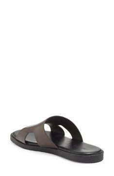 A cutout vamp adds a breezy feel to this vacation-ready slide sandal fashioned with a cushioned footbed. Synthetic upper, lining and sole Imported Modern Sport Sandals With Removable Insole For Beach, Modern Beach Sport Sandals With Arch Support, Classic Slip-on Slides For Summer, Modern Sandals With Rubber Sole For Vacation, Modern Vacation Sandals With Rubber Sole, Classic Leather Footbed Flip Flops For Vacation, Classic Open Toe Flip Flops For Beach, Beach Slides With Ortholite Insole And Open Toe, Modern Beach Sandals With Comfortable Insole