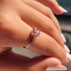 a woman's hand with a ring on it