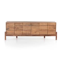 the sideboard is made out of wood and has four drawers, one with two doors