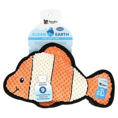 an orange and white fish shaped dishcloth with the words clean earth written on it