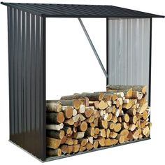 a stack of logs in front of a metal structure