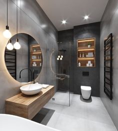 a bathroom with a sink, mirror and bathtub in the center is lit by two round lights