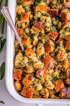 a casserole dish filled with stuffing and vegetables