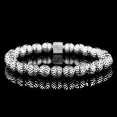 About Specifications Complete your outfit with our Silver bracelet. Handcrafted in The Netherlands by professional artisans with the best Nature has to offer and finished with 925 Sterling Silver. - Gems: Silver - Stone size: 8mm - Metal: 925 Sterling silver - Cord: High-end durable silicone - Packaging: Comes with a luxurious box (Due to the unique characteristics of natural stone, the size and color of the beads can vary slightly.) Silicone Packaging, Bracelet Stand, Unique Opal, Mens Bracelets, Labradorite Bracelet, Unique Characteristics, Mens Beaded Bracelets, Jasper Stone, Bracelet Collection