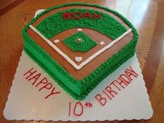 a baseball themed birthday cake with the number 10 on it's base and field