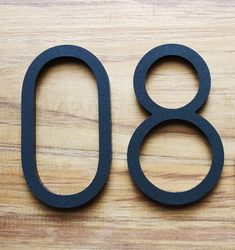 the number 80 is made out of black rubber