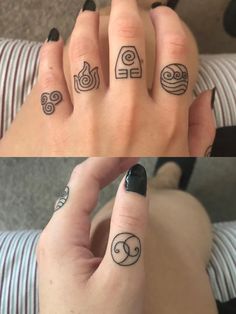 two fingers with different tattoos on them