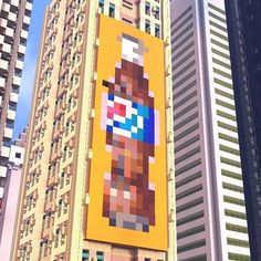 a large advertisement on the side of a tall building