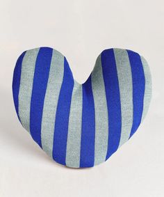 a blue and gray striped heart shaped pillow