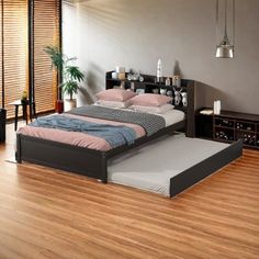 a bed sitting on top of a hard wood floor