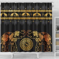 an elephant shower curtain with gold and black designs on the front, along with two elephants that are facing each other