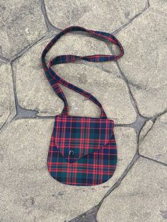 Holyrood tartan shoulder or cross body bag Compliments my range of pinafores and hair bows. Plastic popper fastening. Strap length approximately 33 inches Bag size approximately 6.5x6.5 inches. Due to the pattern on the fabric each bag is different.  Polyester viscose fabric with black lining inside, Suitable for approximately 2 years to 10 years Plaid Rectangular Shoulder Bag For School, Plaid Rectangular Bag For School, Rectangular Plaid Bag For School, Rectangular Plaid Bags For School, Rectangular Plaid School Bag, Robertson Tartan, Macdonald Tartan, Macleod Tartan, Mackenzie Tartan