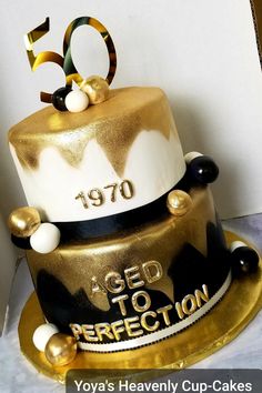 a 50th birthday cake with gold and black decorations