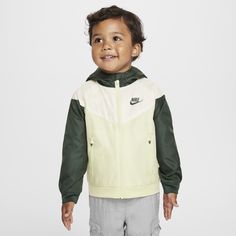 The Nike Sportswear Windrunner Jacket is made with smooth, durable fabric that has the classic 26° chevron design. Zippered side pockets give little ones a place to put their hands. Nike Green Outerwear With Adjustable Hood, Nike Green Sportswear Windbreaker, Nike Sporty Windbreaker, Green Hooded Nike Windbreaker, Nike Green Hooded Jacket For Sports, Nike Green Hooded Track Jacket, Green Sports Outerwear With Zipper Closure, Nike Green Track Jacket For Fall, Windrunner Jacket