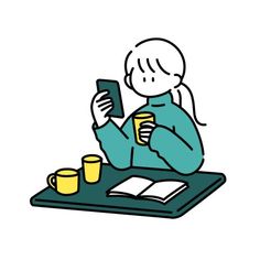 a person sitting at a table using a cell phone and holding a cup with a book in front of them