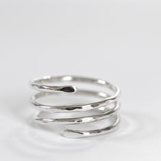 Sterling silver ring in the shape of a triple spiral, adjustable.  A very comfortable and versatile design.  The silver band can also be worn as a thumb ring for both men and women. It can be a great gift idea for a birthday or anniversary. Please, before buying, check your size carefully with a ring similar to this one. To be sure, measure the inside diameter of a similar ring and compare it with the diagram in the picture above. If you can, send me the internal diameter of your ring. If you ha Adjustable Sterling Silver Midi Rings With A Modern Twist, Adjustable Silver Midi Rings With Modern Twist, Modern Twist Adjustable Sterling Silver Midi Rings, Adjustable Spiral Silver Midi Rings, Adjustable Spiral Midi Rings In Silver, Adjustable Silver Spiral Midi Rings, Minimalist Sterling Silver Spiral Ring, Minimalist Spiral Sterling Silver Ring, Silver Spiral Sterling Silver Ring