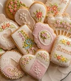 some decorated cookies are on a plate with the words sunny written in it and flowers