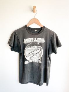 Original Grateful Dead t-shirt from the 1978 "On The Road" tour. Perfectly faded. Made in USA. Fabric: CottonFit: S Measurements: Bust 35" Shoulder 15.5" Sleeve (from collar) 10.5" Length 23.5" Waist 35" Condition: Very good. Underarm seams pulling very slightly apart and one small hole in graphic (see photo). Faded Washed Band Merch T-shirt, Vintage Washed Black T-shirt For Concert, Faded Crew Neck T-shirt Band Merch, Vintage Graphic Print T-shirt For Fall, Vintage Faded T-shirt With Screen Print, Band Merch Washed T-shirt For Concerts, Band Merch Concert T-shirt Washed, Faded Band Merch T-shirt, Concert Washed Cotton T-shirt