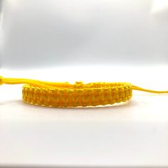 This bracelet is make with Chinese Knotting Cord about 1.5mm thin cord. The Bracelet is adjustable in size, 6 inches closed to 12 1/2 inches. Color: Bright Yellow Feel free to contact me for any question!! *Color may slightly different due to the lighting!! ** This is HANDMADE item, the color of pattern, shape might be little different Chinese Knotting Cord, Chinese Knotting, Surfer Bracelets, Lucky Bracelet, Bracelet Simple, Chinese Knot, Yoga Bracelet, Cord Bracelet, String Bracelet