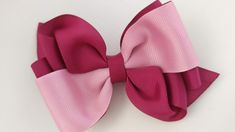 a pink bow on a white background