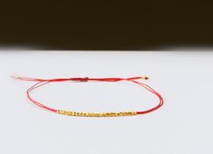 Delicate Silk Bracelet Red string minimalistic wish | Etsy Minimalist Handmade Gold Friendship Bracelets, Handmade Minimalist Gold Friendship Bracelets, Red Friendship Bracelets With Gold Beads As Gift, Red Friendship Bracelet With Gold Beads As Gift, Adjustable Gold Friendship Bracelets, Handmade Gold Friendship Bracelets For Gift, Sisters Bracelet, Kabbalah Bracelet, Silk Bracelet